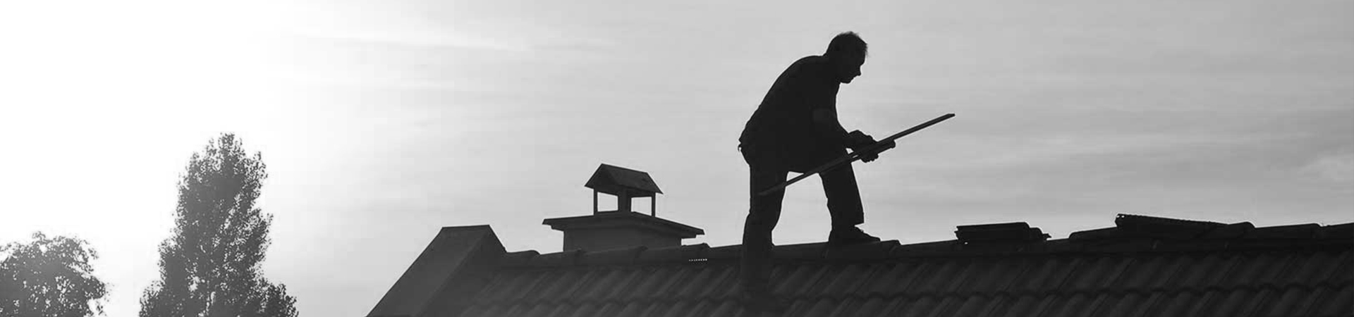 man-working-roofing-monterey-ca